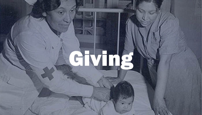 A Native American nurse with a new mom and infant