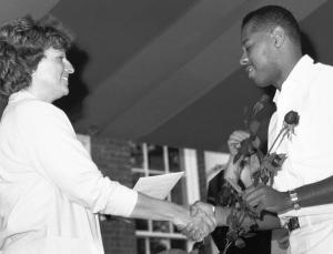 1987 pinning.	JoAnne H. Peach, MSN, President of the University of Virginia School of Nursing Alumni Council with graduating student. Eleanor Crowder Bjoring Center for Nursing Historical Inquiry, University of Virginia School of Nursing.