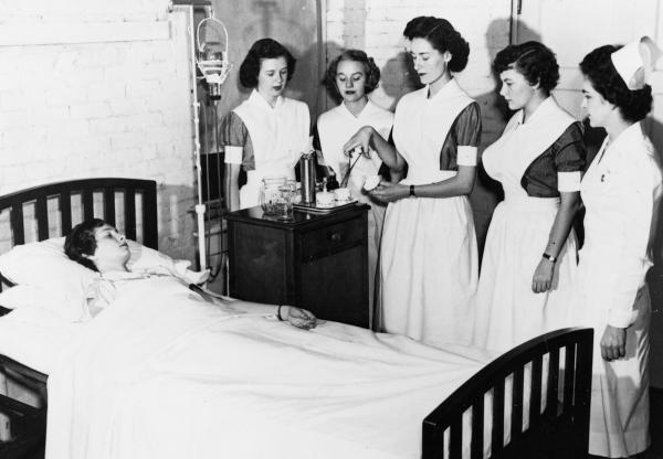 Anne Pollok Hemmings, RN, a 1947 graduate who became an instructor, teaches patient care in the Nursing Arts Laboratory, c. 1949.	Nursing school, Albert and Shirley Small Special Collections Library, University of Virginia.