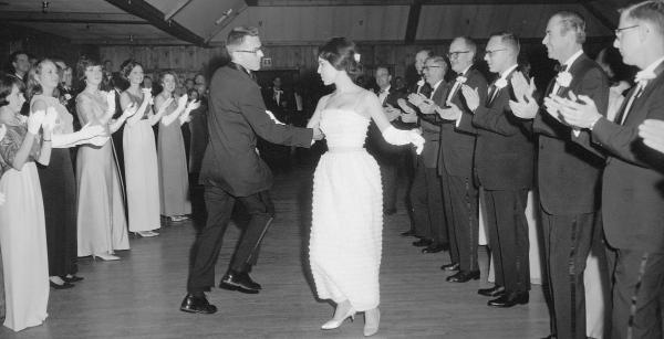 School of Medicine Dean Kenneth Crispell swings his nursing student partner at the senior dance, in the traditional Virginia Reel.	Eleanor Crowder Bjoring Center for Nursing Historical Inquiry, University of Virginia School of Nursing. Ralph Thompson, Photographer.